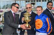9 September 2023; Trainer Aidan O'Brien, left, owner Michael Tabor, centre, and jockey Ryan Moore after winning the Royal Bahrain Irish Champion Stakes with Auguste Rodin during day one of the Irish Champions Festival at Leopardstown Racecourse in Dublin. Photo by Seb Daly/Sportsfile