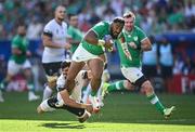 9 September 2023; Bundee Aki of Ireland is tackled by Marius Simionescu of Romania during the 2023 Rugby World Cup Pool B match between Ireland and Romania at Stade de Bordeaux in Bordeaux, France. Photo by Harry Murphy/Sportsfile