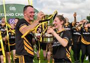 10 September 2023; Joint The Heath capatains Dwayne Keane, left, and Grace Salmon celebrate with the trophy after their side's victory in the GAA Rounders All Ireland Senior Finals match between Limekiln Rounders GAA and The Heath at Kinnegad GAA in Kinnegad, Westmeath. Photo by Tyler Miller/Sportsfile