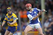 26 June 2004; Michael McEvoy, Laois, in action against Tony Griffin, Clare. Guinness Senior Hurling Championship Qualifier, Round 1, Clare v Laois, Gaelic Grounds, Limerick. Picture credit; Ray McManus / SPORTSFILE