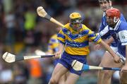 26 June 2004; Tony Griffin, Clare, in action against Michael McEvoy, and Paul Cuddy, back, Laois. Guinness Senior Hurling Championship Qualifier, Round 1, Clare v Laois, Gaelic Grounds, Limerick. Picture credit; Ray McManus / SPORTSFILE