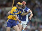 26 June 2004; Tony Griffin, Clare, in action against Michael McEvoy, Laois. Guinness Senior Hurling Championship Qualifier, Round 1, Clare v Laois, Gaelic Grounds, Limerick. Picture credit; Ray McManus / SPORTSFILE