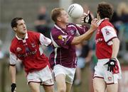 3 July 2004; Michael Donnellan, Galway, in action against David Devaney and Paudie Mallon, right, Louth. Bank of Ireland Football Championship Qualifier, Round 2, Galway v Louth, Parnell Park, Dublin. Picture credit; SPORTSFILE