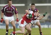 3 July 2004; Gary Fahey, left, and Thomas Meehan, Galway, in action against Mark Stanfield, Louth. Bank of Ireland Football Championship Qualifier, Round 2, Galway v Louth, Parnell Park, Dublin. Picture credit; SPORTSFILE