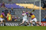4 July 2004; Wexford goalkeeper Damien Fitzhenry and Paul Carley combine to stop a penalty by Offaly's Damien Murray. Guinness Leinster Senior Hurling Championship Final, Offaly v Wexford, Croke Park, Dublin. Picture credit; Brendan Moran / SPORTSFILE