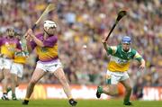 4 July 2004; David O'Connor, Wexford, in action against Brian Carroll, Offaly. Guinness Leinster Senior Hurling Championship Final, Offaly v Wexford, Croke Park, Dublin. Picture credit; Pat Murphy / SPORTSFILE