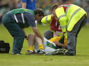 3 July 2004; Shane McKeigue, Meath, is put on a stretcher by first aid personnel and the Meath team doctor. Bank of Ireland Football Championship Qualifier, Round 2, Fermanagh v Meath, Brewster Park, Enniskillen, Co. Fermanagh. Picture credit; Brendan Moran / SPORTSFILE