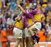 4 July 2004; Wexford players celebrate with Rory McCarthy, (centre) after victory over Offaly. Guinness Leinster Senior Hurling Championship Final, Offaly v Wexford, Croke Park, Dublin. Picture credit; Damien Eagers / SPORTSFILE
