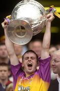 4 July 2004; Wexford's Eoin Quigley lifts the Bob O'Keeffe cup. Guinness Leinster Senior Hurling Championship Final, Offaly v Wexford, Croke Park, Dublin. Picture credit; Damien Eagers / SPORTSFILE