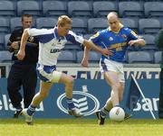 3 July 2004; Padraic Davis, Longford, Waterford, in action against Trevor Costelloe, Waterford. Bank of Ireland Football Championship Qualifier, Round 2, Longford v Waterford, O'Moore Park, Portlaoise, Co. Laois. Picture credit; Pat Murphy / SPORTSFILE