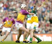 4 July 2004; David O'Connor, Wexford, in action against Brian Carroll, Offaly. Guinness Leinster Senior Hurling Championship Final, Offaly v Wexford, Croke Park, Dublin. Picture credit; Pat Murphy / SPORTSFILE