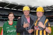 28 August 2013; The Sunday Game Presenter Michael Lyster was joined today in Croke Park by motor neurone disease (MND) sufferer Paul Lannon and friends sporting their county colours to encourage others from across Ireland to abseil 100ft off the Hogan Stand in aid of the Irish Motor Neurone Disease Association (IMNDA). At the event is Michael Lyster and Paul Lannon, from Knocktopher, Co. Kilkenny, Mayo supporter Pauline Egan, from Kilkelly, Co. Mayo. Croke Park, Dublin. Picture credit: Brian Lawless / SPORTSFILE