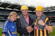28 August 2013; The Sunday Game Presenter Michael Lyster was joined today in Croke Park by motor neurone disease (MND) sufferer Paul Lannon and friends sporting their county colours to encourage others from across Ireland to abseil 100ft off the Hogan Stand in aid of the Irish Motor Neurone Disease Association (IMNDA). At the event is Michael Lyster and Paul Lannon, from Knocktopher, Co. Kilkenny, with Cavan supporter Mary Reavey, from Kingscourt, Co. Cavan. Croke Park, Dublin. Picture credit: Brian Lawless / SPORTSFILE