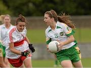 1 September 2013; Mairead Daly, Offaly, in action against Noleen Murphy, Derry. All-Ireland Ladies Football Junior Championship, Semi-Final, Offaly v Derry, Carrickmacross Emmets GAA Club, Emmet Park, Monaghan. Picture credit: Oliver McVeigh / SPORTSFILE