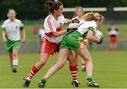 1 September 2013; Treasa McManus, Offaly, in action against Rachel Walls, Derry. All-Ireland Ladies Football Junior Championship, Semi-Final, Offaly v Derry, Carrickmacross Emmets GAA Club, Emmet Park, Monaghan. Picture credit: Oliver McVeigh / SPORTSFILE