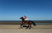3 September 2013; Beat the Bell, with Adrienne Foley up, make their way to the start of the Marquees Nationwide Handicap. Laytown Races, Laytown, Co. Meath. Picture credit: Brian Lawless / SPORTSFILE