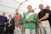 3 September 2013; Jockeys and members of the media watch the Tote Mobile Betting Handicap on the TV in the media tent. Laytown Races, Laytown, Co. Meath. Picture credit: Brian Lawless / SPORTSFILE
