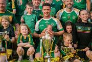 10 September 2023; Carrickmacross Emmets captain Colm Kiernan celebrates with his son, Colm Kiernan, aged 6 weeks, and the trophy after his side's victory in the GAA Rounders All Ireland Senior Finals match between Carrickmacross Emmets and Erne Eagles at Kinnegad GAA in Kinnegad, Westmeath. Photo by Tyler Miller/Sportsfile