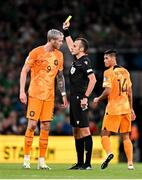 10 September 2023; Referee Irfan Peljto shows a yellow card to Wout Weghorst of Netherlands during the UEFA EURO 2024 Championship qualifying group B match between Republic of Ireland and Netherlands at the Aviva Stadium in Dublin. Photo by Sam Barnes/Sportsfile
