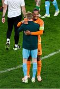 10 September 2023; Republic of Ireland goalkeeper Caoimhin Kelleher embraces his Liverpool teammate Virgil van Dijk of Netherlands after the UEFA EURO 2024 Championship qualifying group B match between Republic of Ireland and Netherlands at the Aviva Stadium in Dublin. Photo by Ben McShane/Sportsfile