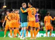 10 September 2023; Virgil van Dijk of Netherlands with Republic of Ireland goalkeeper Caoimhin Kelleher after the UEFA EURO 2024 Championship qualifying group B match between Republic of Ireland and Netherlands at the Aviva Stadium in Dublin. Photo by Stephen McCarthy/Sportsfile