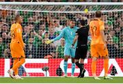 10 September 2023; Republic of Ireland goalkeeper Gavin Bazunu reacts as he is shown a yellow card by referee Irfan Peljto after conceding a penalty during the UEFA EURO 2024 Championship qualifying group B match between Republic of Ireland and Netherlands at the Aviva Stadium in Dublin. Photo by Seb Daly/Sportsfile