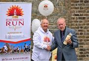 12 September 2023;Remembrance Run 5K Founder Frank Greally presents a candle to Tommy Gorman, brother of the late Harry Gorman, at Phoenix Park Visitor Centre in Dublin for the official launch of the Remembrance Run 5k supported by Silver Stream Healthcare which takes place in the Phoenix Park on Sunday, November 12th, 2023. Further information available at www.remembrancerun.ie. Photo by Sam Barnes/Sportsfile