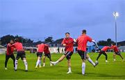 15 September 2023; Danny Grant of Bohemian, centre, warm ups up with team-mates before the Sports Direct Men’s FAI Cup quarter-final match between Drogheda United and Bohemians at Weavers Park in Drogheda, Louth. Photo by Seb Daly/Sportsfile