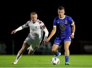 15 September 2023; Niall O'Keeffe of Waterford in action against Jack Doherty of Cobh Ramblers during the SSE Airtricity Men's First Division match between Waterford and Cobh Ramblers at RSC in Waterford. Photo by Michael P Ryan/Sportsfile