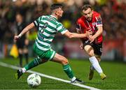 15 September 2023; Paul McMullan of Derry City in action against Ronan Finn of Shamrock Rovers during the SSE Airtricity Men's Premier Division match between Derry City and Shamrock Rovers at The Ryan McBride Brandywell Stadium in Derry. Photo by Stephen McCarthy/Sportsfile