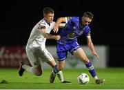 15 September 2023; Darragh Power of Waterford in action against Mikie Rowe of Cobh Ramblers during the SSE Airtricity Men's First Division match between Waterford and Cobh Ramblers at RSC in Waterford. Photo by Michael P Ryan/Sportsfile