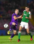 15 September 2023; Cian Coleman of Cork City in action against Corban Piper of Wexford during the Sports Direct Men’s FAI Cup quarter final match between Cork City and Wexford at Turner's Cross in Cork. Photo by Eóin Noonan/Sportsfile