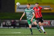 15 September 2023; Rory Gaffney of Shamrock Rovers in action against Cameron McJannet of Derry City during the SSE Airtricity Men's Premier Division match between Derry City and Shamrock Rovers at The Ryan McBride Brandywell Stadium in Derry. Photo by Stephen McCarthy/Sportsfile