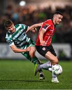 15 September 2023; Michael Duffy of Derry City in action against Ronan Finn of Shamrock Rovers during the SSE Airtricity Men's Premier Division match between Derry City and Shamrock Rovers at The Ryan McBride Brandywell Stadium in Derry. Photo by Stephen McCarthy/Sportsfile