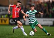 15 September 2023; Michael Duffy of Derry City in action against Ronan Finn of Shamrock Rovers during the SSE Airtricity Men's Premier Division match between Derry City and Shamrock Rovers at The Ryan McBride Brandywell Stadium in Derry. Photo by Stephen McCarthy/Sportsfile