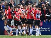 15 September 2023; Cameron McJannet of Derry City, centre, celebrates with team-mates after scoring his side's first goal during the SSE Airtricity Men's Premier Division match between Derry City and Shamrock Rovers at The Ryan McBride Brandywell Stadium in Derry. Photo by Stephen McCarthy/Sportsfile