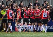 15 September 2023; Cameron McJannet of Derry City, hidden, celebrates with team-mates after scoring their side's first goal during the SSE Airtricity Men's Premier Division match between Derry City and Shamrock Rovers at The Ryan McBride Brandywell Stadium in Derry. Photo by Stephen McCarthy/Sportsfile