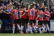 15 September 2023; Cameron McJannet of Derry City, hidden, celebrates with team-mates after scoring their side's first goal during the SSE Airtricity Men's Premier Division match between Derry City and Shamrock Rovers at The Ryan McBride Brandywell Stadium in Derry. Photo by Stephen McCarthy/Sportsfile