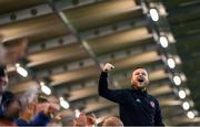 15 September 2023; A Derry City supporter celebrates after his side scores their first goal during the SSE Airtricity Men's Premier Division match between Derry City and Shamrock Rovers at The Ryan McBride Brandywell Stadium in Derry. Photo by Stephen McCarthy/Sportsfile