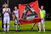 15 September 2023; Bohemians players Dylan Connolly, right, and Keith Buckley hold up a banner in memory of the late Bohemians supporter Dean Merton after the Sports Direct Men’s FAI Cup quarter-final match between Drogheda United and Bohemians at Weavers Park in Drogheda, Louth. Photo by Seb Daly/Sportsfile