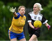 16 September 2023; Clare Logan of All Saint's in Antrim in action against Elaine Carroll of St Mochta's in Louth, left, during the 2023 LGFA/Sports Direct Gaelic4Mothers&Others National Blitz Day at Naomh Mearnóg GAA club in Portmarnock, Dublin. Photo by Piaras Ó Mídheach/Sportsfile