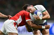 16 September 2023; Hugo Keenan of Ireland is tackled by Tanginoa Halaifonua of Tonga during the 2023 Rugby World Cup Pool B match between Ireland and Tonga at Stade de la Beaujoire in Nantes, France. Photo by Brendan Moran/Sportsfile