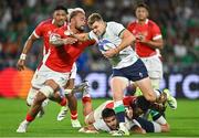 16 September 2023; Garry Ringrose of Ireland is tackled by Vaea Fifita of Tonga during the 2023 Rugby World Cup Pool B match between Ireland and Tonga at Stade de la Beaujoire in Nantes, France. Photo by Brendan Moran/Sportsfile