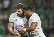 16 September 2023; Bundee Aki of Ireland celebrates with teammate Ross Byrne after scoring his side's sixth try during the 2023 Rugby World Cup Pool B match between Ireland and Tonga at Stade de la Beaujoire in Nantes, France. Photo by Brendan Moran/Sportsfile