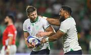 16 September 2023; Bundee Aki of Ireland celebrates with teammate Ross Byrne after scoring his side's sixth try during the 2023 Rugby World Cup Pool B match between Ireland and Tonga at Stade de la Beaujoire in Nantes, France. Photo by Brendan Moran/Sportsfile