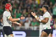 16 September 2023; Bundee Aki of Ireland celebrates with teammate Josh van der Flier after scoring his side's seventh try during the 2023 Rugby World Cup Pool B match between Ireland and Tonga at Stade de la Beaujoire in Nantes, France. Photo by Brendan Moran/Sportsfile