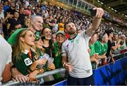 16 September 2023; Hugo Keenan of Ireland takes selfies with supporters after his side's victory in the 2023 Rugby World Cup Pool B match between Ireland and Tonga at Stade de la Beaujoire in Nantes, France. Photo by Brendan Moran/Sportsfile