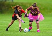 16 September 2023; Bríd O'Neill of Watergrasshill in Cork, left, in action against Sinéad Flanagan of St Maur's in Dublin during the 2023 LGFA/Sports Direct Gaelic4Mothers&Others National Blitz Day at Naomh Mearnóg GAA club in Portmarnock, Dublin. Photo by Piaras Ó Mídheach/Sportsfile