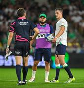 16 September 2023; Ireland captain Jonathan Sexton, right, and teammate Jamison Gibson-Park speak to assistant referee Matthew Carley during the 2023 Rugby World Cup Pool B match between Ireland and Tonga at Stade de la Beaujoire in Nantes, France. Photo by Brendan Moran/Sportsfile