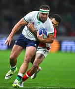 16 September 2023; Rob Herring of Ireland is tackled by William Havili of Tonga during the 2023 Rugby World Cup Pool B match between Ireland and Tonga at Stade de la Beaujoire in Nantes, France. Photo by Brendan Moran/Sportsfile